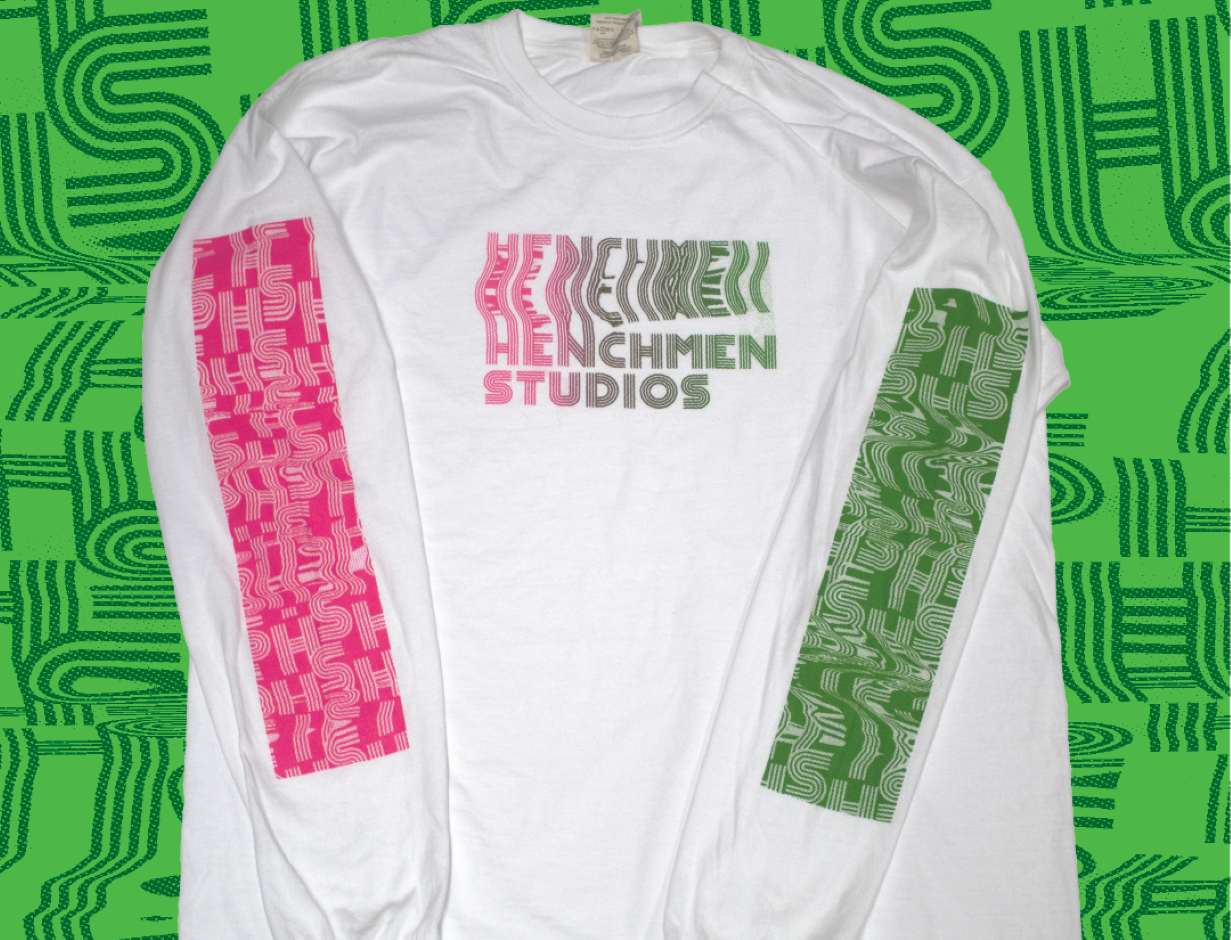 Pink and green longsleeve shirt with Henchmen Studios Logo on top
