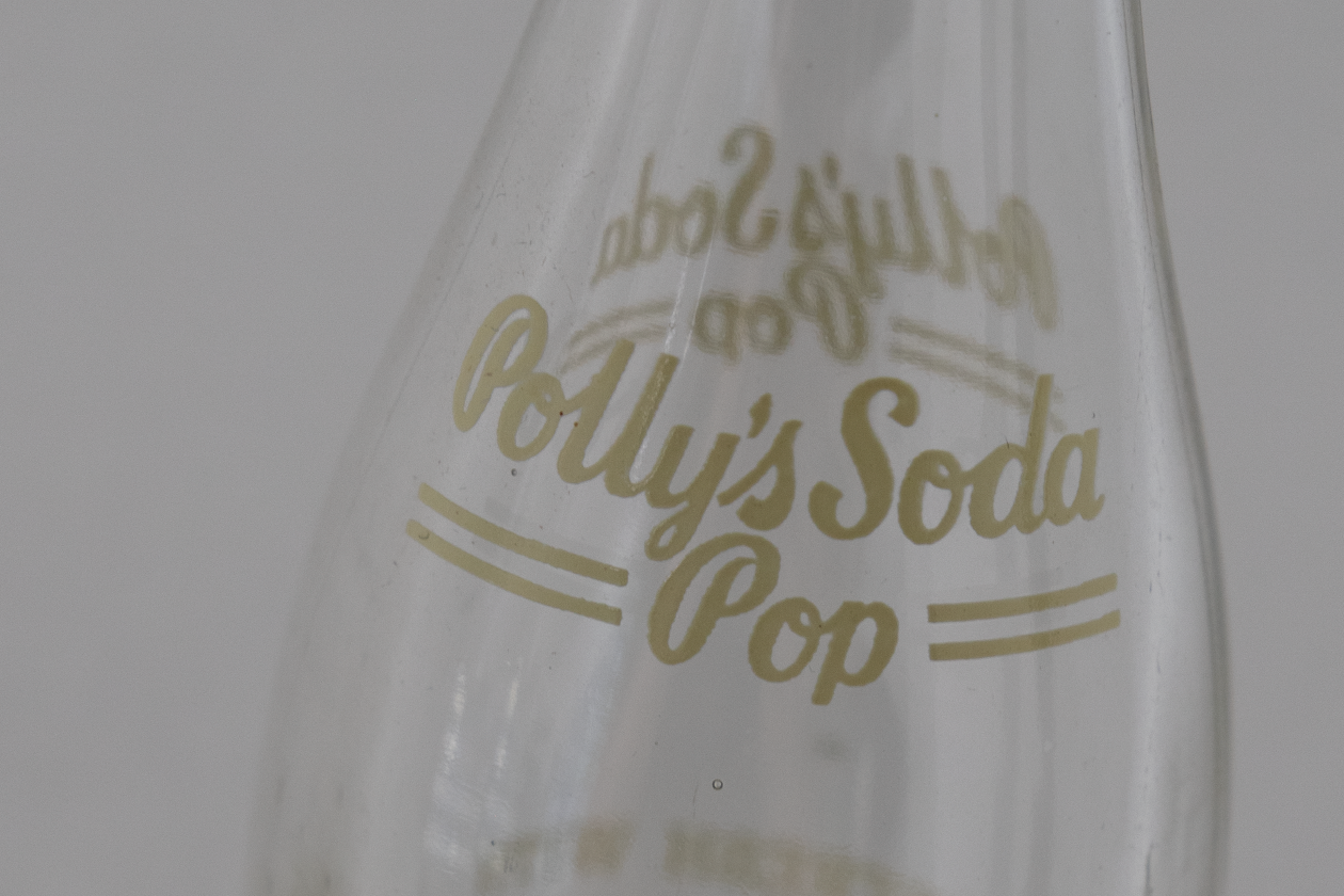 Close up of logo on empty Polly's Pop bottle