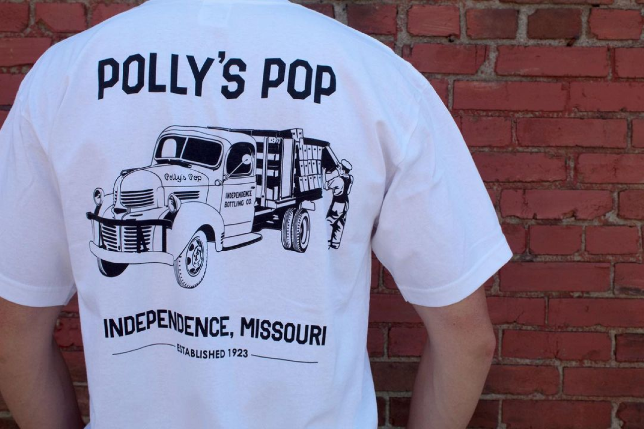 Shirt for Polly's Pop featuring an old-timey farm vehicle